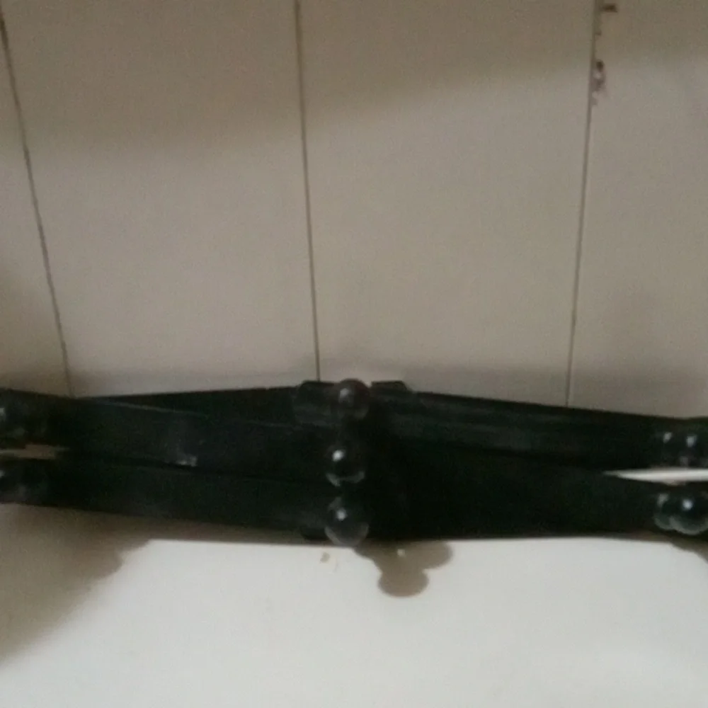 Black Wall-Mounted Coat Rack.